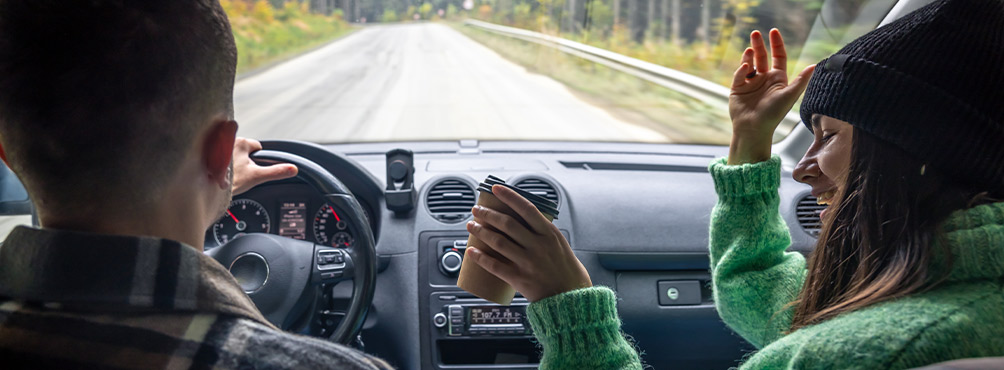 Aerial view of a peaceful coastal village in Pelion, Greece, with a beach, pier, and surrounding hills – perfect vacation spot