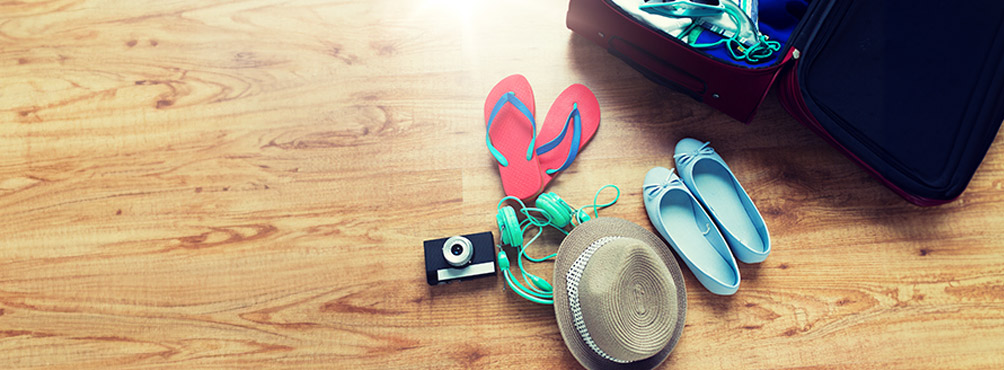 Packed holiday items with sandals, hat and accessories for summer stay at Pelion Esties 