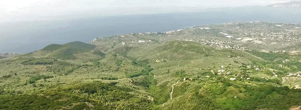 Panoramic aerial view of Pelion mountain landscape meeting Aegean Sea near Pelion Esties