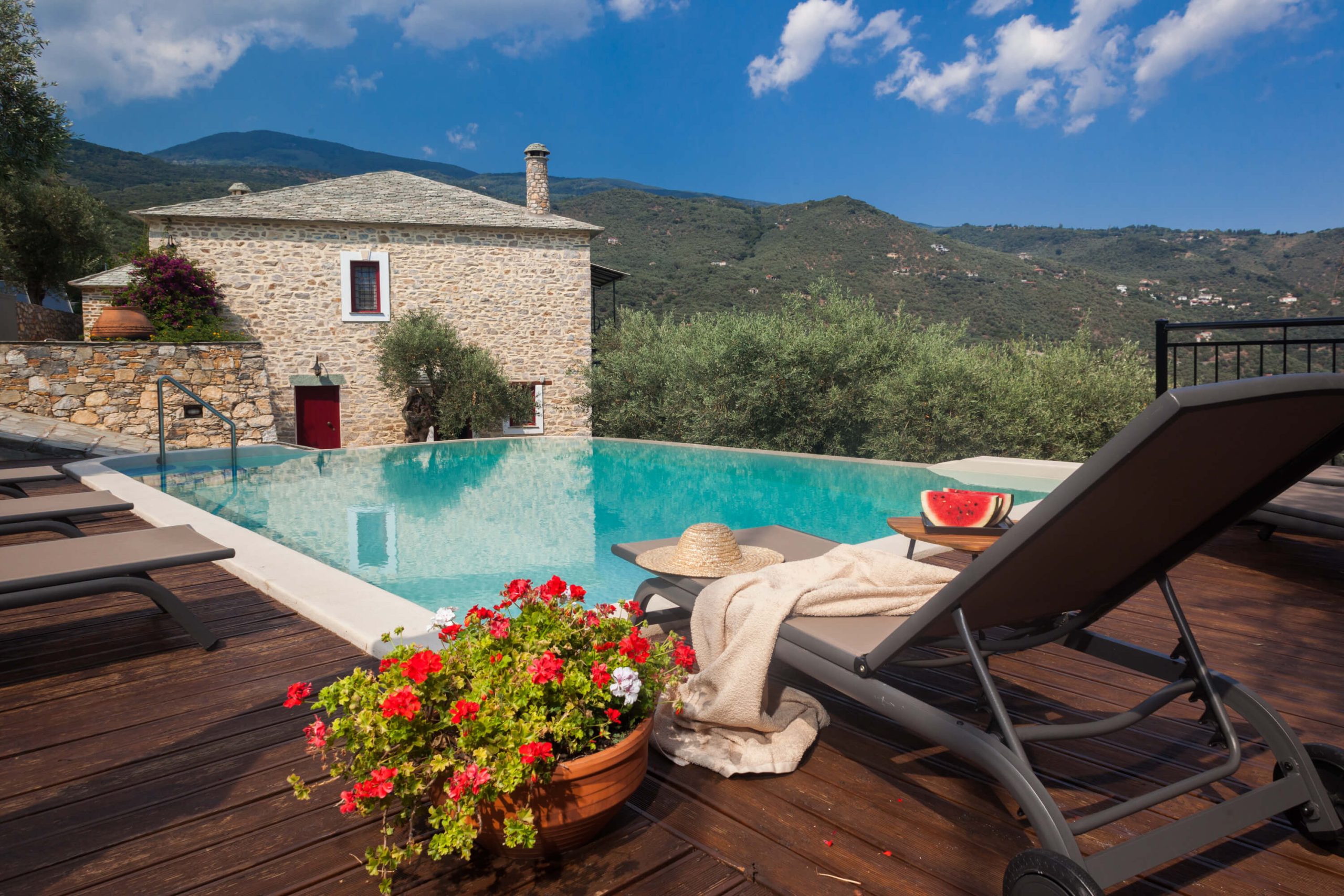 A stunning stone villa with pool and a view of the mountains at Villa Andromachi, Pelion Villas.